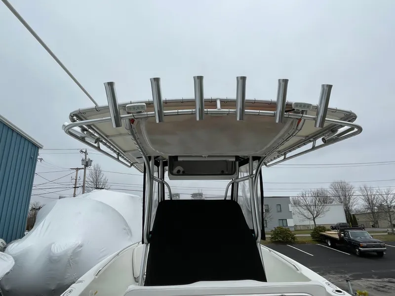 Slide: The Image of 2006 Sailfish 2360 CC boat with T-top and rod holders. - 14