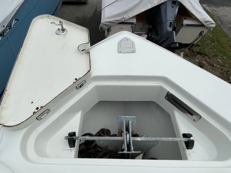 Slide: The Image of Open anchor locker of a 2006 Sailfish 2360 CC boat. - 18