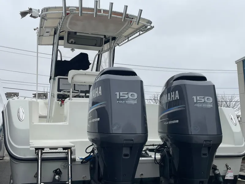 Slide: The Image of 2006 Sailfish 2360 CC boat with twin Yamaha 150 outboard engines. - 2