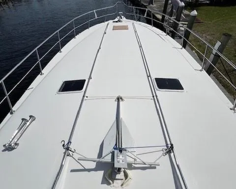 Slide: The Image of Bow deck of 1997 Sea Ray 500 Sundancer yacht with anchor and hatches. - 2