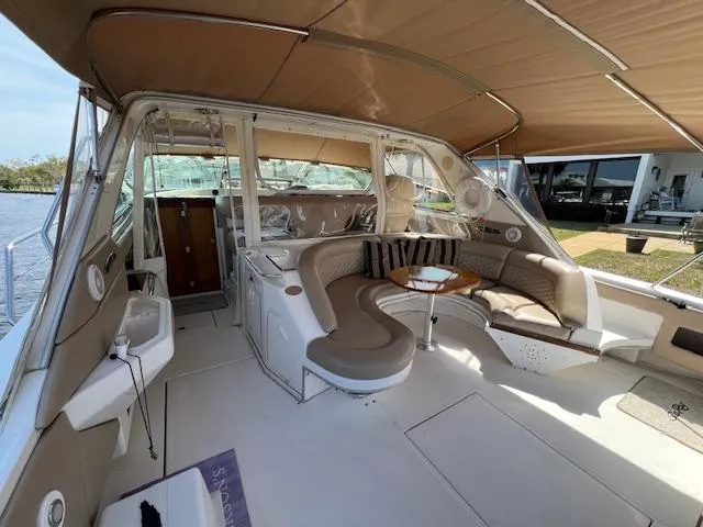 Slide: The Image of 1997 Sea Ray 500 Sundancer yacht interior with spacious seating and table. - 4