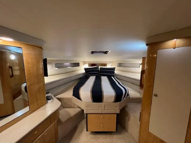 Slide: The Image of Luxurious bedroom interior of 1997 Sea Ray 500 Sundancer yacht. - 9