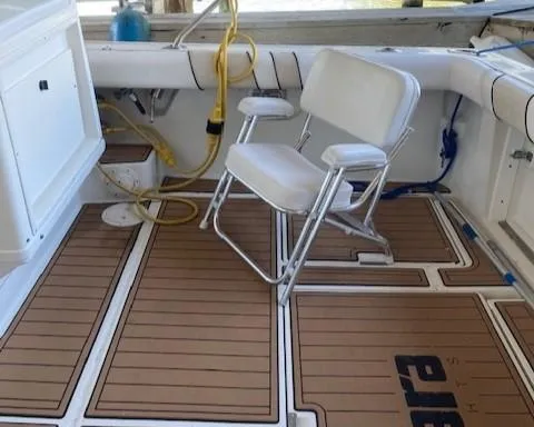 Slide: The Image of 1989 Tiara Yachts 3300 Open boat deck with seating and marine equipment. - 5