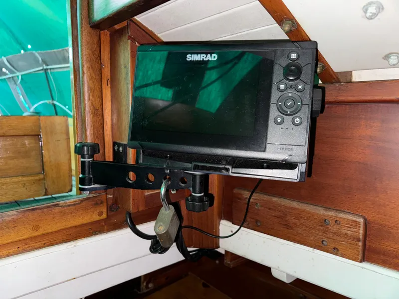 Slide: The Image of Simrad navigation system on 1960 Concordia 39 Yawl, mounted in wooden cabin interior. - 14