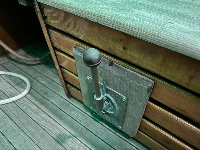 Slide: The Image of Wooden deck and control lever on a 1960 Concordia 39 Yawl sailboat. - 16