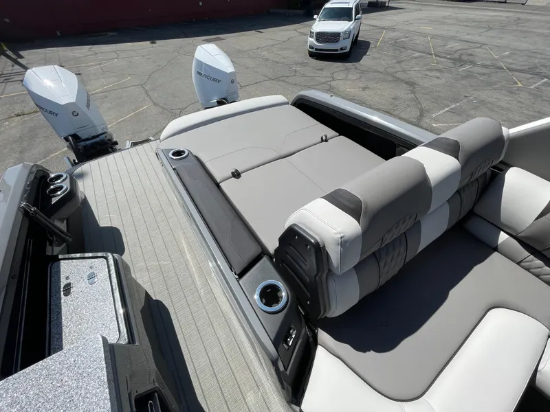 Slide: The Image of 2024 Avalon 2585 EXCALIBUR LTD VRB boat with dual Mercury engines and luxurious seating. - 13