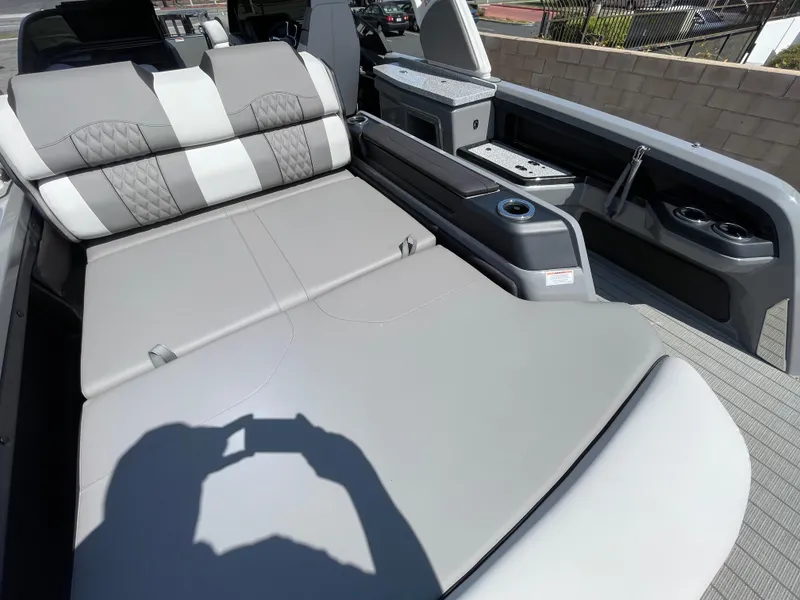 Slide: The Image of 2024 Avalon 2585 EXCALIBUR LTD VRB boat interior with luxurious seating and modern amenities. - 15