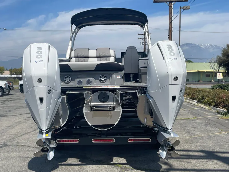 Slide: The Image of 2024 Avalon 2585 EXCALIBUR LTD VRB boat with twin 300 V8 engines, rear view. - 4