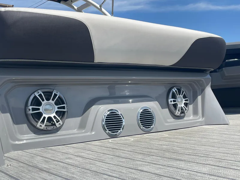 Slide: The Image of 2024 Avalon 2585 EXCALIBUR LTD VRB boat with premium audio system and cushioned seating. - 5