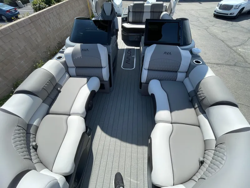 Slide: The Image of 2024 Avalon 2585 EXCALIBUR LTD VRB luxury pontoon boat interior with plush seating. - 7