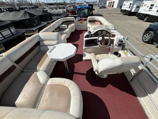 Slide: The Image of 2002 Godfrey Aqua Patio pontoon boat with spacious seating and a central table. - 14