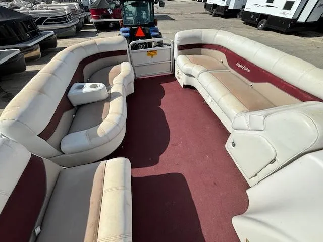 Slide: The Image of 2002 Godfrey Aqua Patio pontoon boat with spacious seating and red carpet. - 21