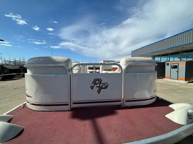 Slide: The Image of 2002 Godfrey Aqua Patio pontoon boat with red carpet and white seating. - 5