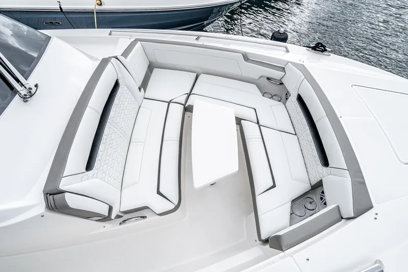 Slide: The Image of 2024 Tiara Yachts 34LS luxury boat seating area with white and gray upholstery. - 11