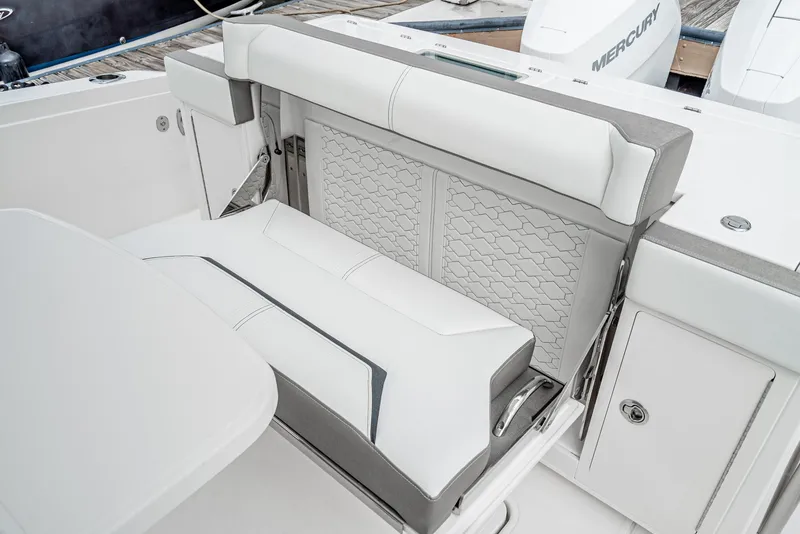 Slide: The Image of 2024 Tiara Yachts 34LS luxury seating area with white upholstery. - 30