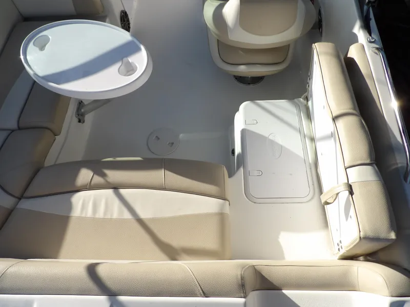 Slide: The Image of 2018 NauticStar 203DC Sport Deck interior with seating and table. - 13