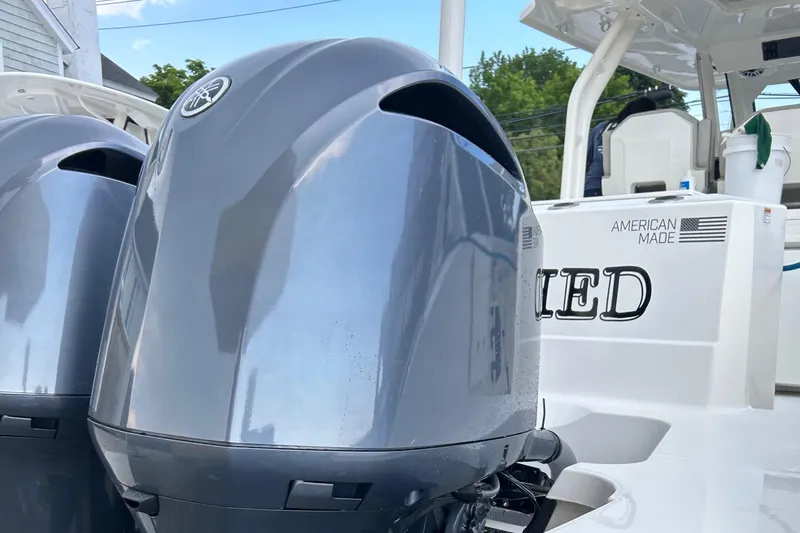 Slide: The Image of 2022 Pursuit S 328 Sport boat with dual outboard motors. - 27