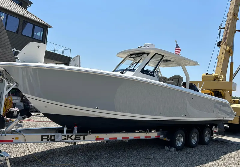 Slide: The Image of 2022 Pursuit S 328 Sport boat on a trailer, ready for launch. - 3