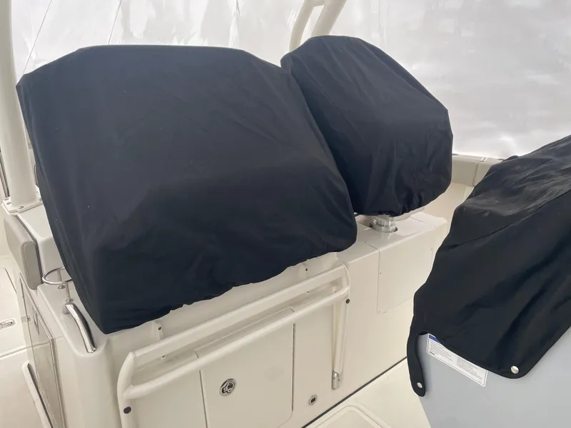 Slide: The Image of 2022 Pursuit S 328 Sport boat with covered seats and console. - 36