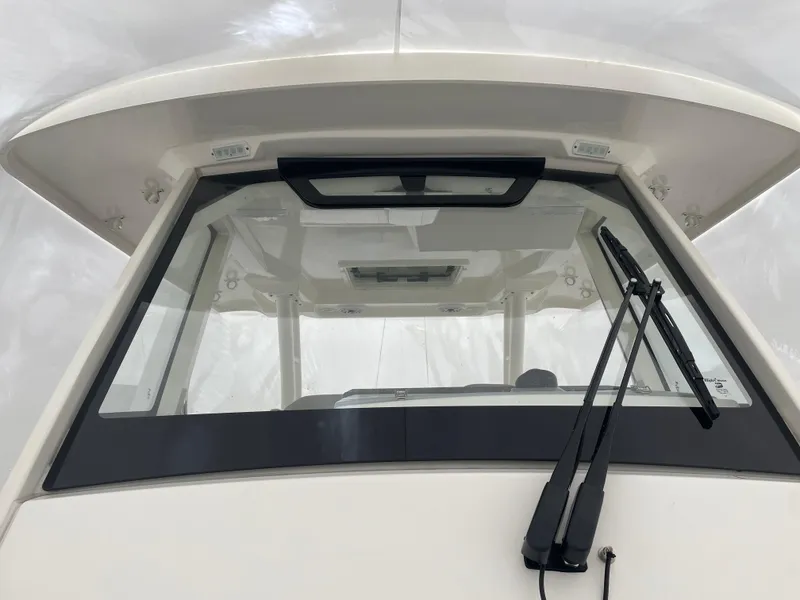 Slide: The Image of 2022 Pursuit S 328 Sport boat windshield and wipers. - 39