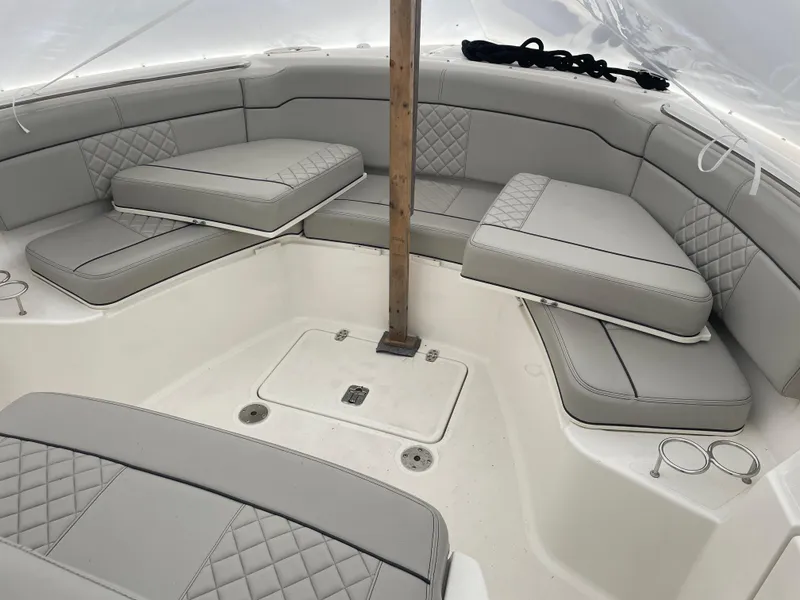 Slide: The Image of 2022 Pursuit S 328 Sport boat with luxurious gray seating and cup holders. - 41