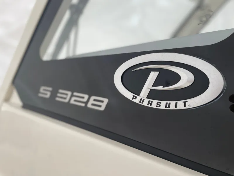 Slide: The Image of Close-up of 2022 Pursuit S 328 Sport boat logo and model name. - 42