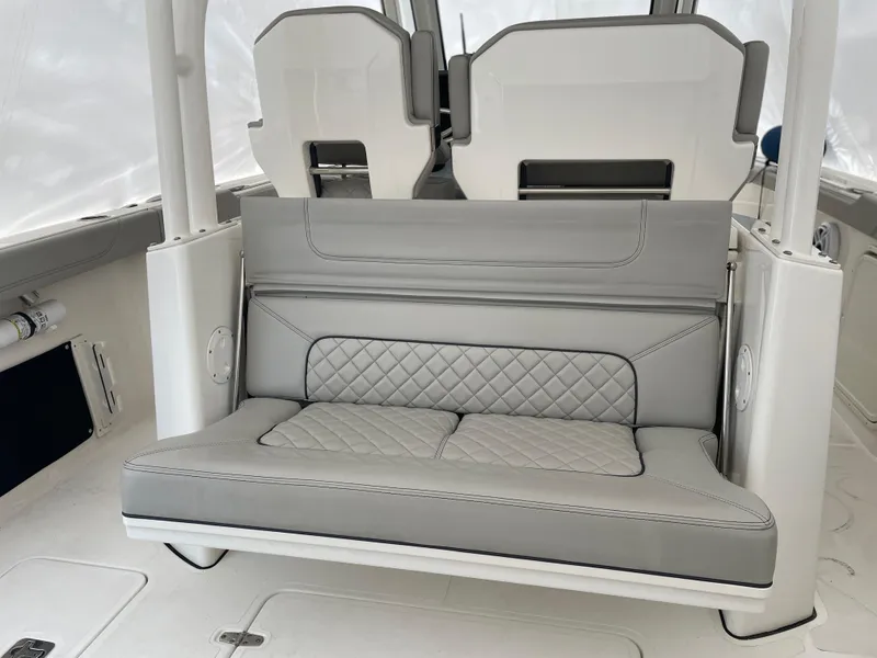 Slide: The Image of 2022 Pursuit S 328 Sport boat with luxurious gray seating and diamond stitching. - 44