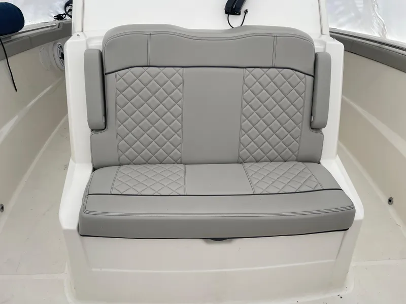 Slide: The Image of 2022 Pursuit S 328 Sport boat with gray diamond-stitched seating. - 45