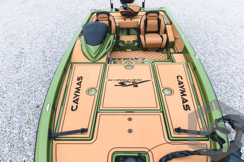 Slide: The Image of 2024 Caymas XS 20 Pro boat with tan and green deck. - 13