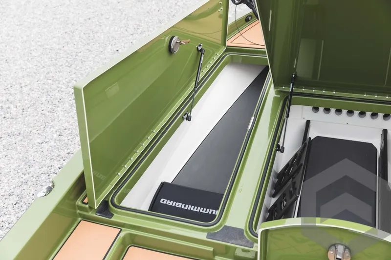 Slide: The Image of 2024 Caymas XS 20 Pro storage compartments and rod holders. - 16