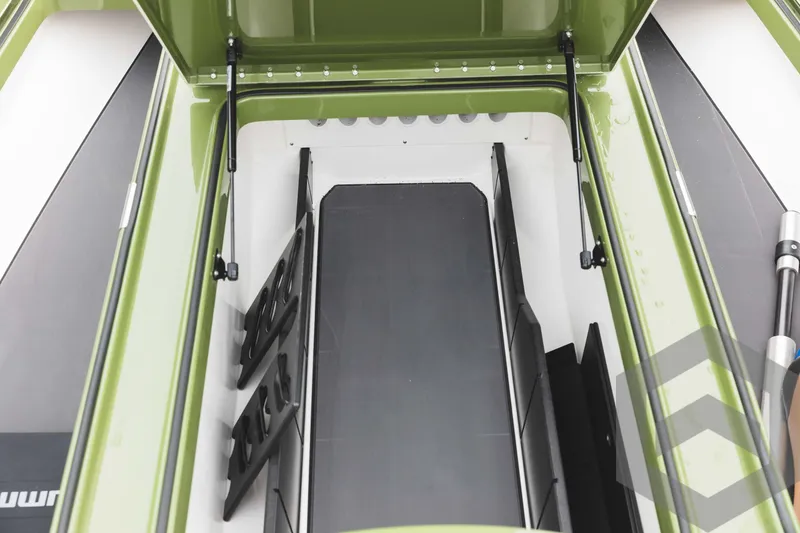 Slide: The Image of 2024 Caymas XS 20 Pro boat storage compartment with open lid. - 17