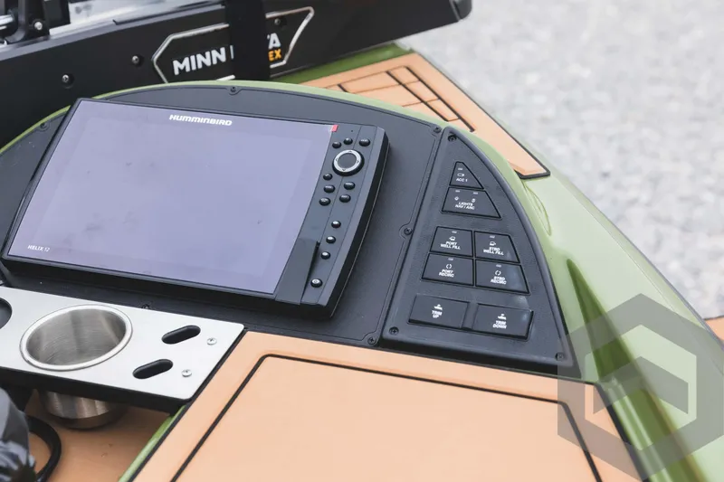 Slide: The Image of 2024 Caymas XS 20 Pro boat console with Humminbird display and control panel. - 22