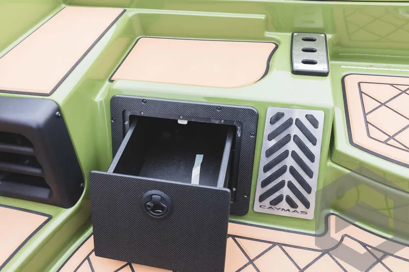 Slide: The Image of 2024 Caymas XS 20 Pro boat storage compartment with open drawer. - 25