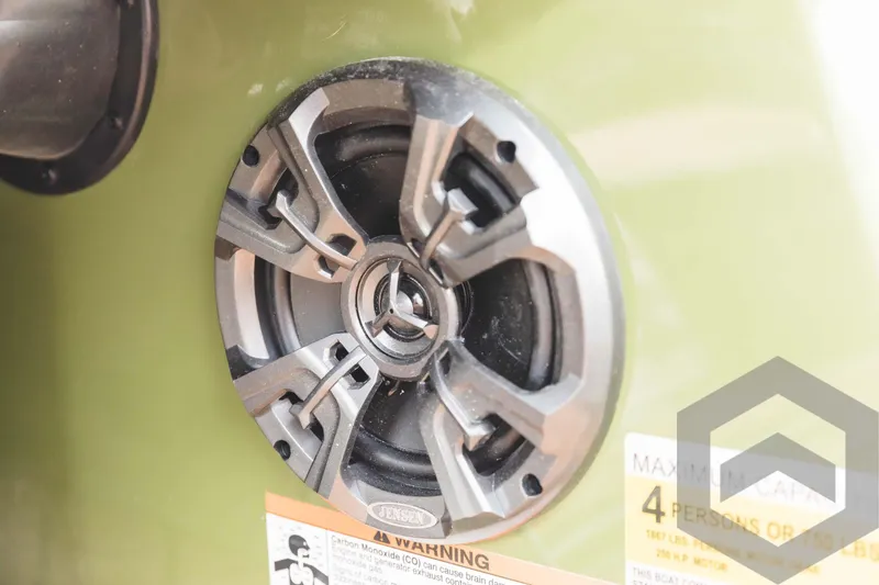 Slide: The Image of 2024 Caymas XS 20 Pro boat speaker and safety warning label. - 27