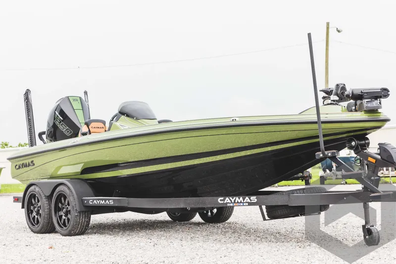 Slide: The Image of 2024 Caymas XS 20 Pro boat on trailer, green and black color scheme. - 3