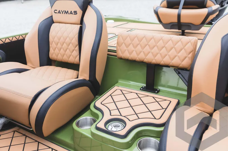 Slide: The Image of 2024 Caymas XS 20 Pro boat interior with tan and black diamond-stitched seats. - 32