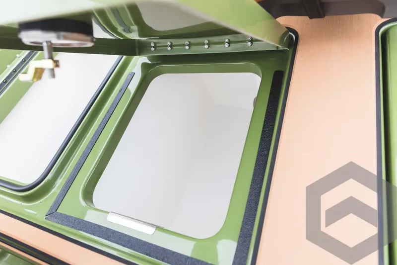 Slide: The Image of 2024 Caymas XS 20 Pro storage compartment with open hatch. - 37