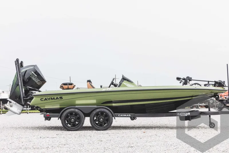 Slide: The Image of 2024 Caymas XS 20 Pro boat in green and black on a trailer. - 4
