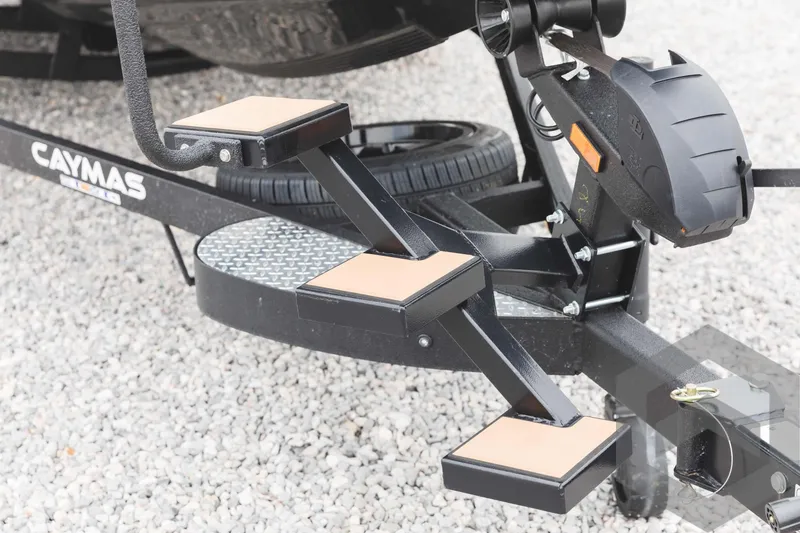 Slide: The Image of 2024 Caymas XS 20 Pro boat trailer with steps and spare tire. - 45