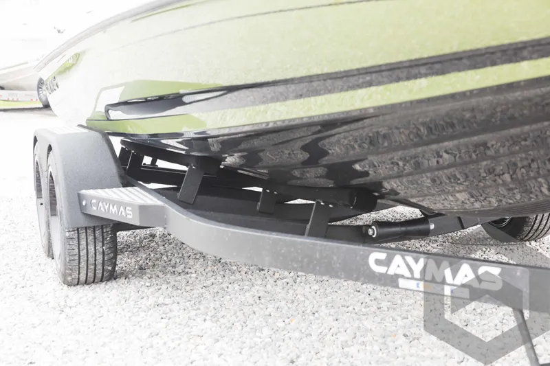 Slide: The Image of 2024 Caymas XS 20 Pro boat on trailer, close-up view of hull and wheels. - 48