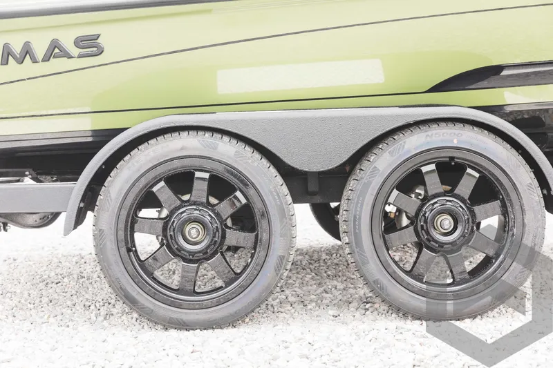 Slide: The Image of 2024 Caymas XS 20 Pro trailer with black alloy wheels on gravel. - 49