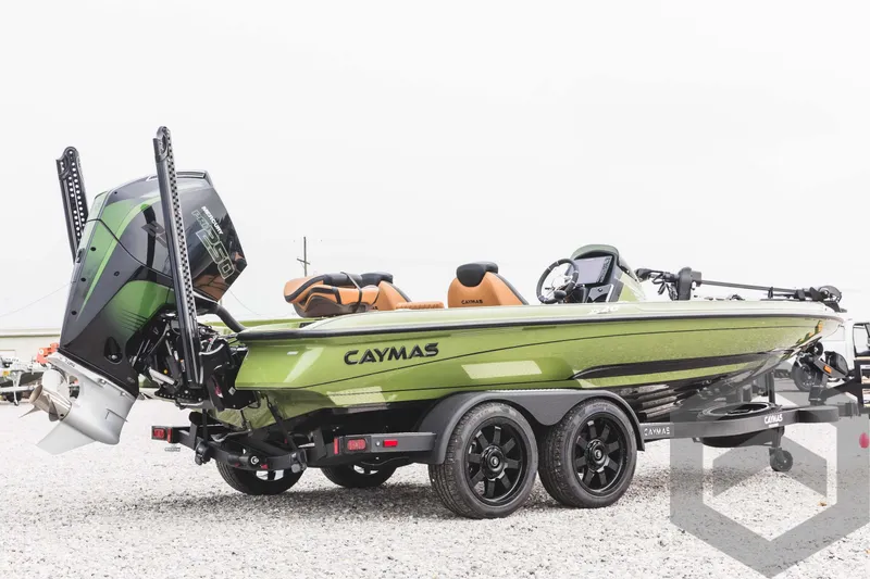 Slide: The Image of 2024 Caymas XS 20 Pro bass boat in green on a trailer. - 5