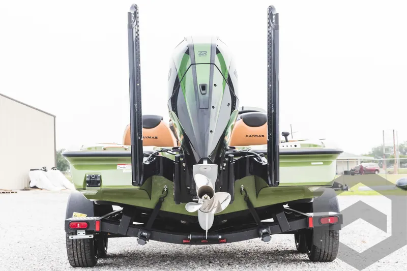 Slide: The Image of 2024 Caymas XS 20 Pro boat rear view with outboard motor and trailer. - 6