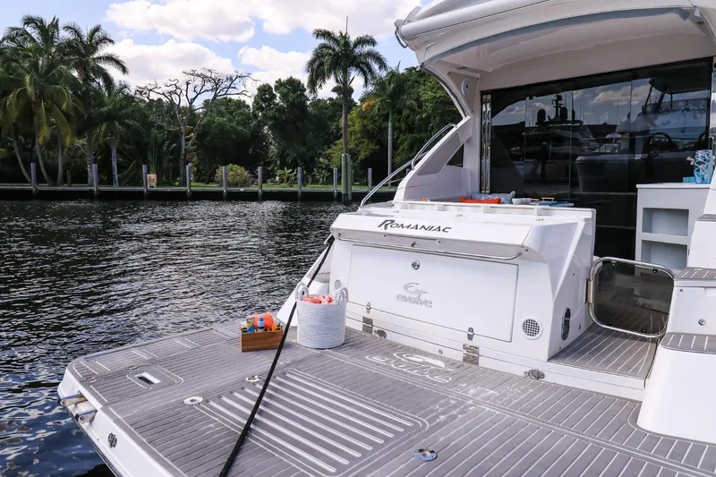 Slide: The Image of Luxury Evolve 400HT yacht docked by a scenic waterfront, 2021 model. - 11