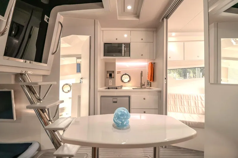 Slide: The Image of Modern interior of 2021 Evolve 400HT yacht with sleek kitchen and dining area. - 13