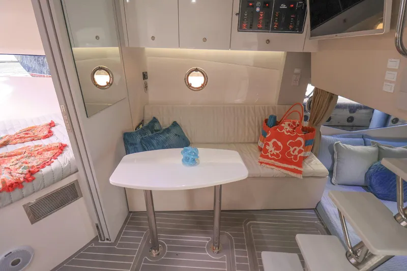 Slide: The Image of Interior of 2021 Evolve 400HT yacht with seating, table, and colorful decor. - 15