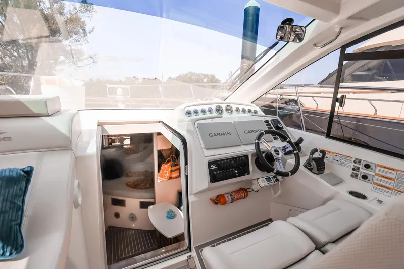 Slide: The Image of Cockpit of 2021 Evolve 400HT yacht with modern controls and seating. - 18