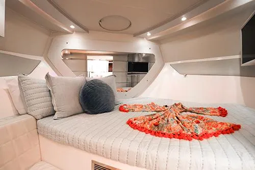 Slide: The Image of Luxurious interior of 2021 Evolve 400HT yacht with elegant bedding and modern design. - 24