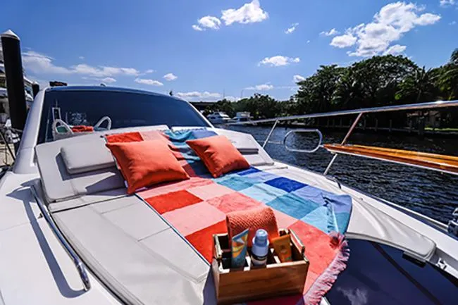 Slide: The Image of Luxury Evolve 400HT yacht with colorful deck setup, cruising on a sunny day, 2021 model. - 26