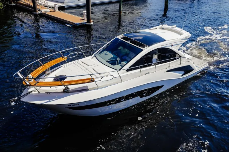 Slide: The Image of Luxury Evolve 400HT yacht cruising on water, 2021 model, sleek design, sunny day. - 3